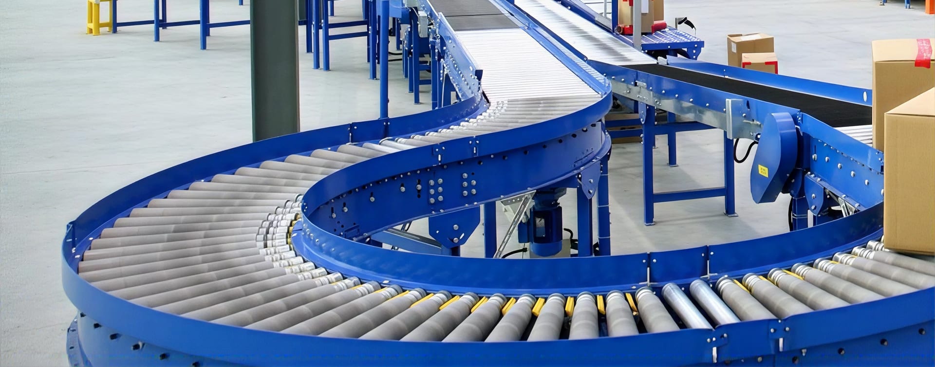 Curved blue roller conveyor handling cartons
